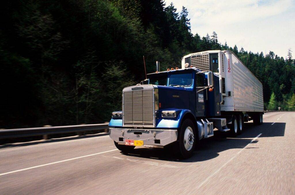 Semi-truck driving on road
